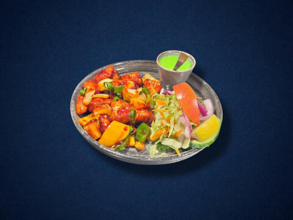 Chilli stir-fry with peppers and a green dipping sauce