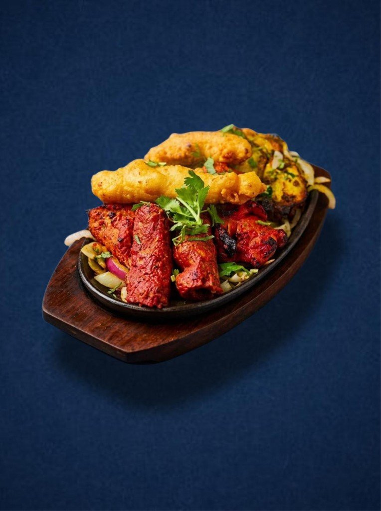 Mixed tandoori grill on a sizzling platter